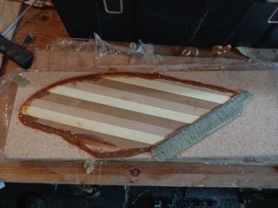  The wood is glued to the fiberglass base. 