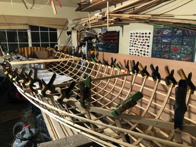  11/19/17 - The overhanging ribs are cut off and inwale spacer blocks are epoxied to the gunwale. 