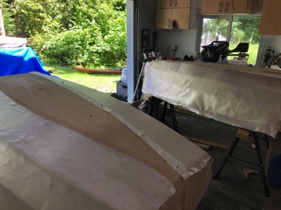  6 oz. fiberglass is laid on the hulls.  