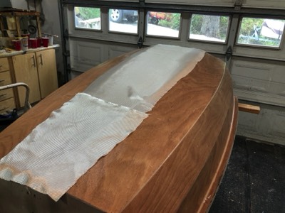  6/19/20 - 8 oz. fiberglass is laid on the hull.  