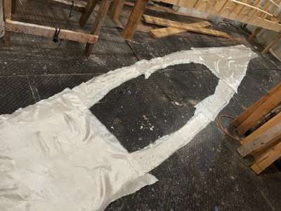  12/2/21 - Fiberglass cloth is laid on the underside of the deck. 