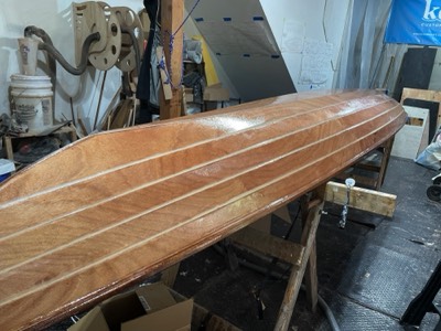  7/27/22 - Epoxy seal coats are applied to the hull. 