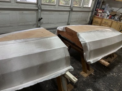  12/1/22 - Fiberglass is laid on the hulls.  