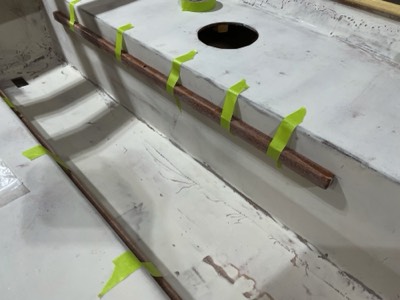  Mounts for sliding seat rails are epoxied in place. 