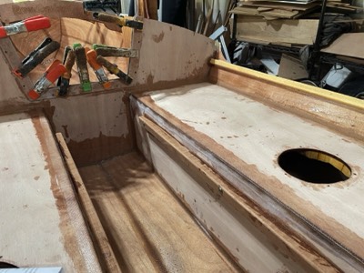  The second companionway piece and the sliding seat support rails are epoxied in place.  