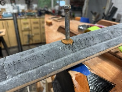  4/5/25 - The oversize bolt hole is filled with epoxy. 