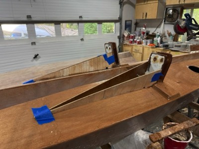 Water diversion pieces are epoxied in place on the amas.  