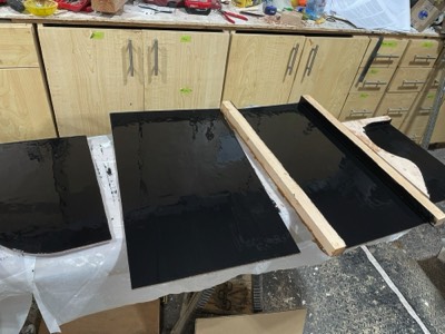  The inside faces of the daggerboard and rudder trunk are given graphite/epoxy coats. 