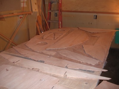  1/30/11 - The reverse sides of the bulkheads are sanded. 