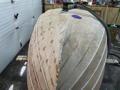  6/29/23 - Half of the hull is sanded. 